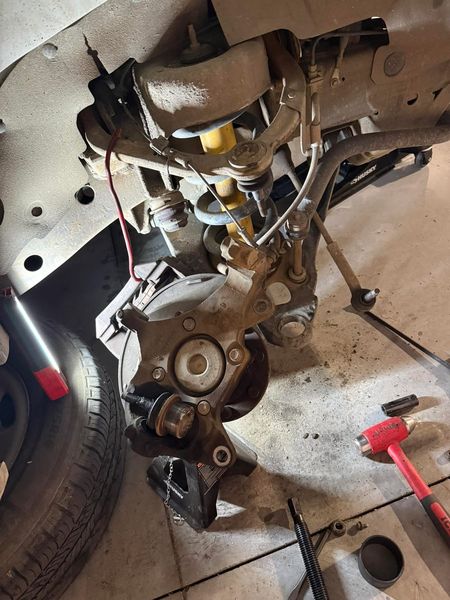 Car front suspension with the knuckle, ball joint and strut exposed