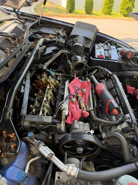 Car engine with the valve cover off during a valve cover gasket job